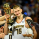 Nikola Jokic of the Denver Nuggets celebrates as the team wins the NBA Championship
